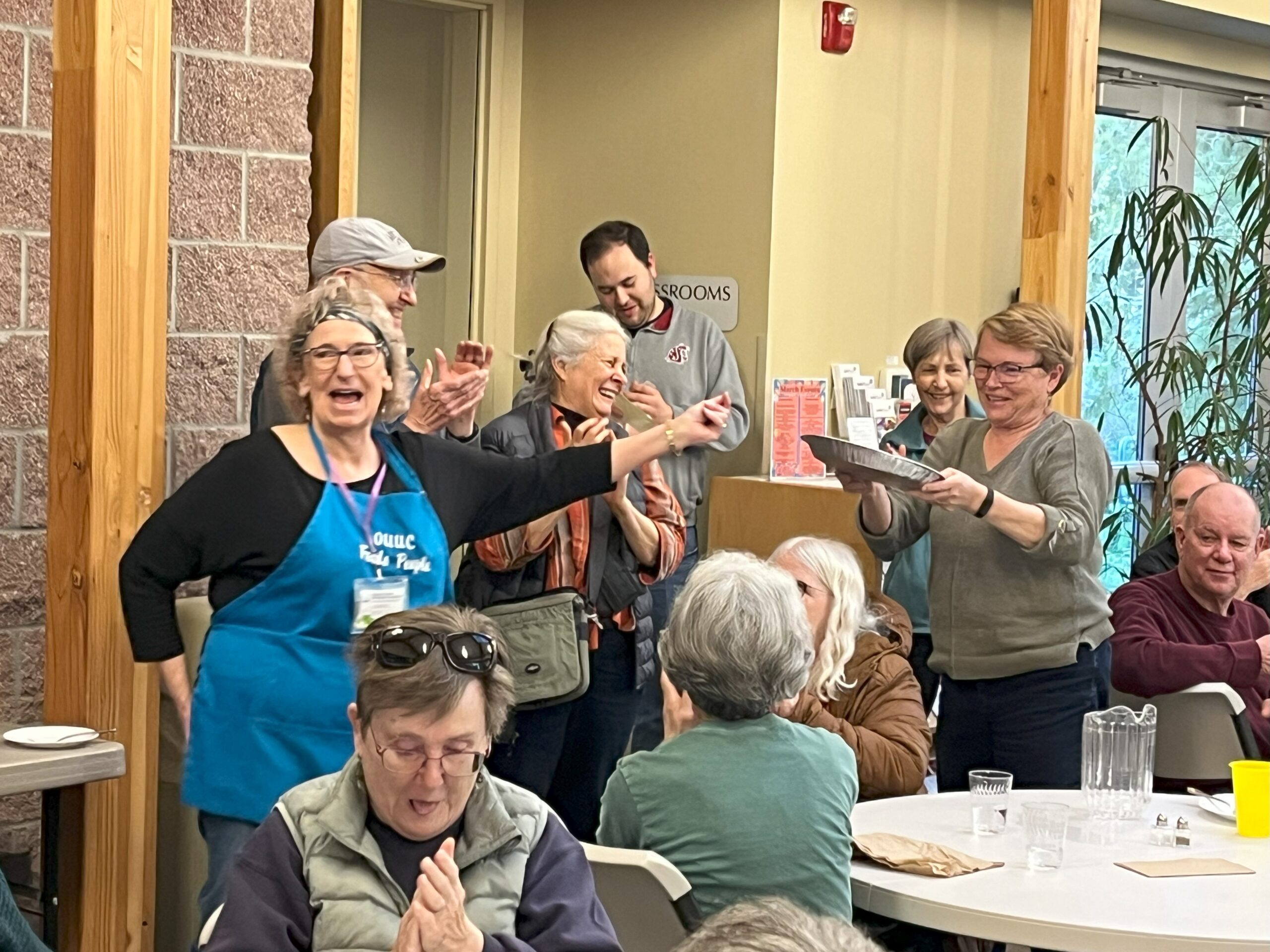 people laughing together at a Thursday dinner event